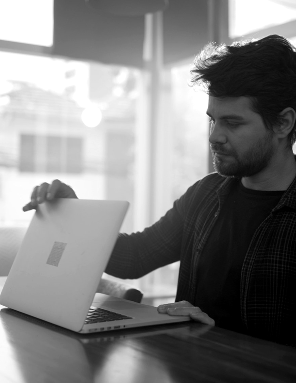 A person working on a Microsoft Surface laptop